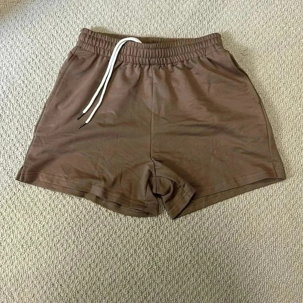 Cute, brown, athletic shorts 4”. elastic waste drawstring